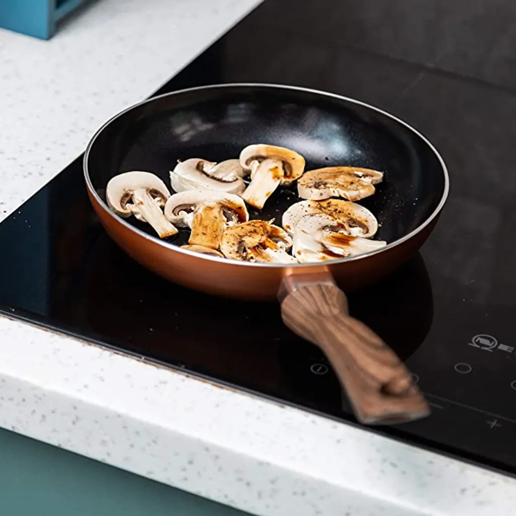 Nuovva Kupfer Bratpfanne - Keramische Antihaftbeschichtung - Holzgriff Bratpfanne - Ø 24 Cm Induktion - PTFE-frei 7 Nuovva Kupfer Bratpfanne - Keramische Antihaftbeschichtung - Holzgriff Bratpfanne - Ø 24 Cm Induktion - PTFE-frei – Bild 7